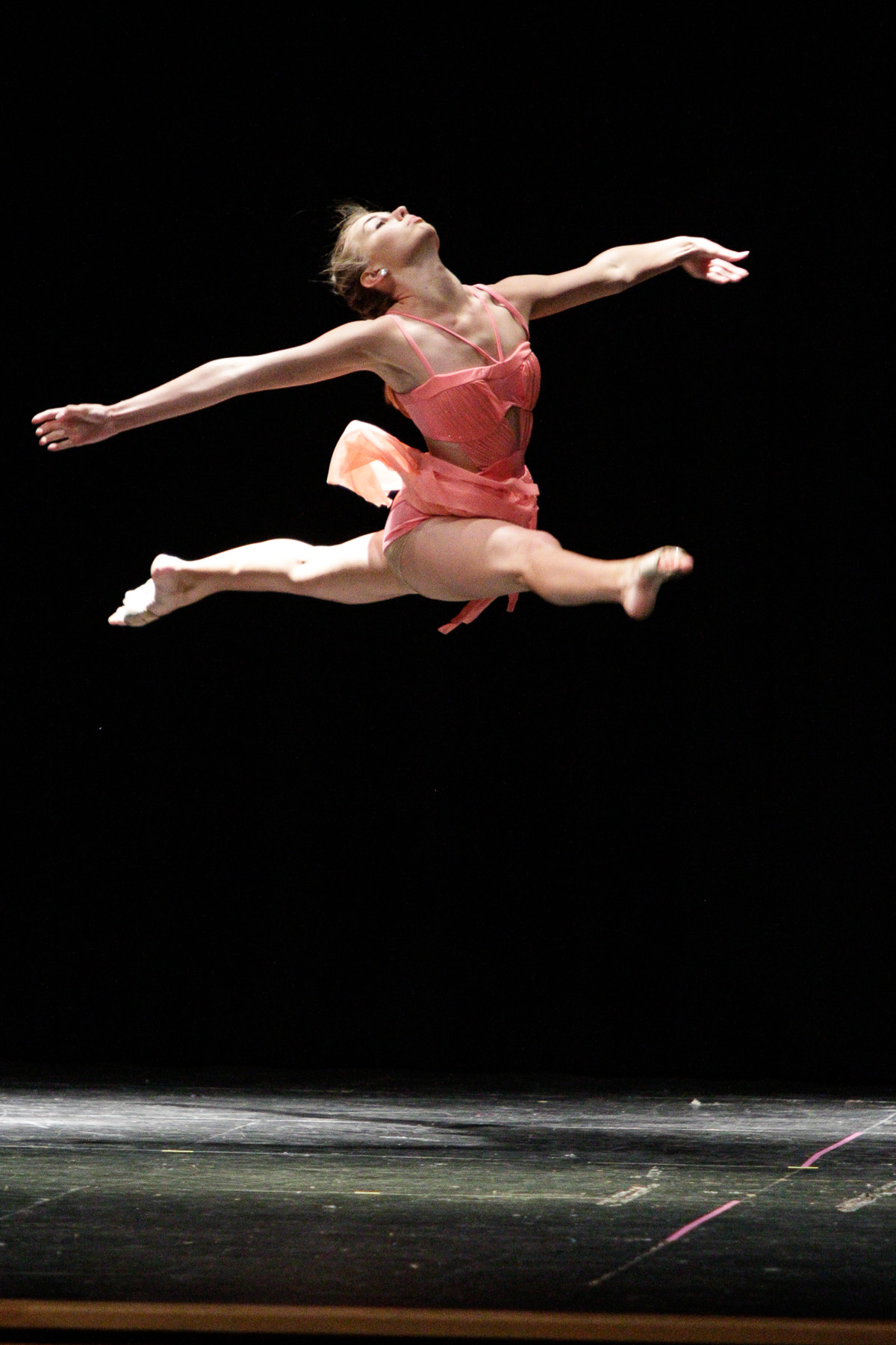 Erica Payne leaps in her performance of the Breath of Life, during the Performing Fine Arts of Sealy's dance recital at Sealy Junior High's auditorium.