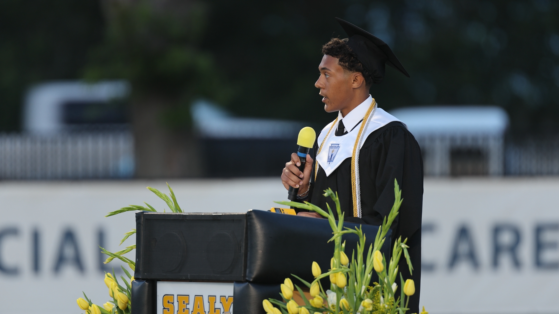 Sealy Class of 2026 Valedictorian Aiden Johnson gives his address at T.J. Mills Stadium on May 21, 2026. (Ronin Visuals photo by Creighton Holub, all rights reserved.)
